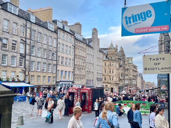 People walking in a busy city centre street. 